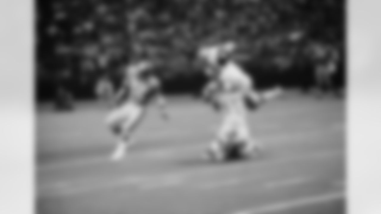 New Orleans Saints running back Tony Baker (38) caught by Houston Oilers? Willie Alexander (19) as he was jumping Bob Newland (41) in the second quarter after going 20-yards over the middle. The National Football League played in the Houston Astrodome on Saturday, Oct. 4, 1971 in Houston, ended in a 13-13 tie. (AP Photo/EFK)