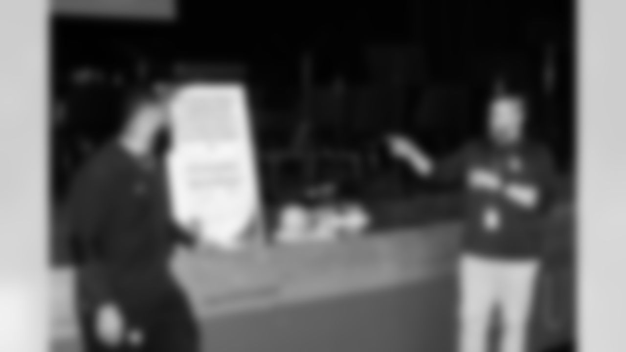 Defensive lineman Jeffery Simmons #98 of the Tennessee Titans speaks to Hunters Lane High School Girls Flag Football team after giving a donation on December 09, 2025 in Nashville, TN. Photo By Donald Page/Tennessee Titans