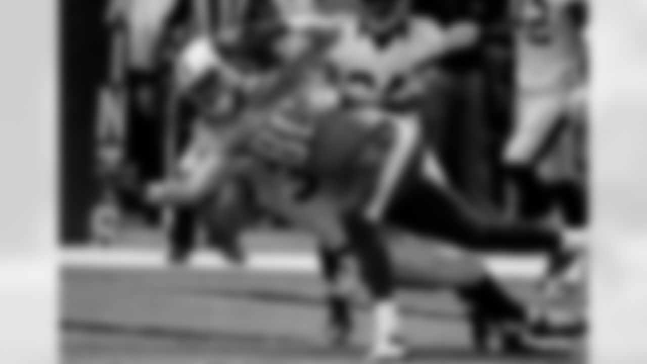 Tennessee Titans tight end Chase Coffman (86) scores on a touchdown reception as New Orleans Saints defensive back Marcus Ball tries to tackle him during the second half of an NFL preseason football game in New Orleans, Friday, Aug. 15, 2014. The Saints won 31-24. (AP Photo/Bill Haber)