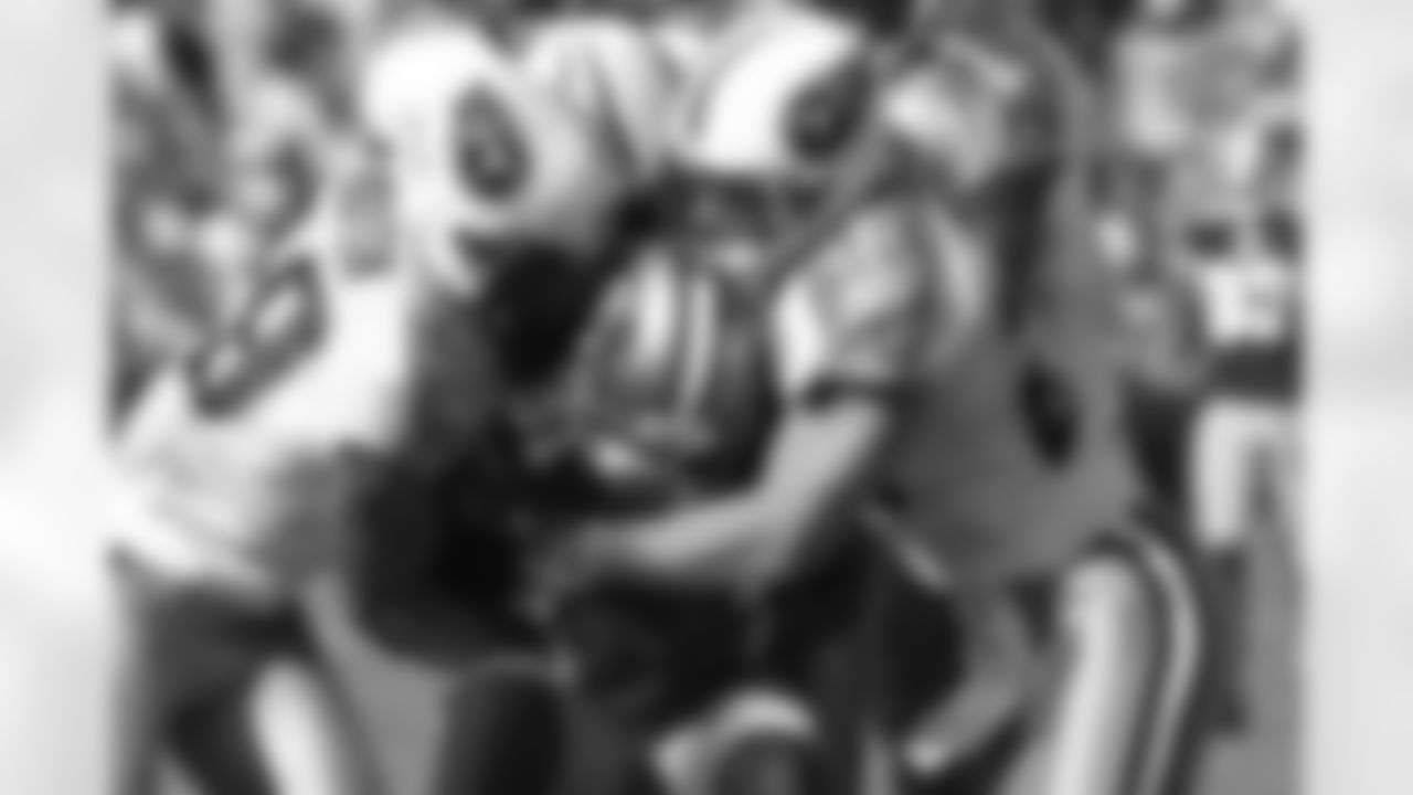 Tennessee Titans cornerback Ryan Mouton (29) and safety Donnie Nickey (23) stop San Francisco 49ers wide receiver Brandon Jones (81) during an NFL game on November 8, 2009. The Titans defeated the 49ers 34-27. (AP Photo/Kevin Terrell)