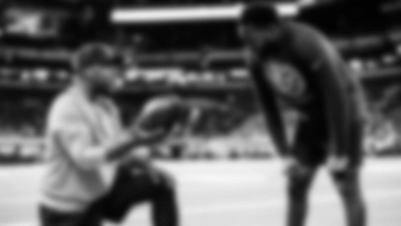 Cornerback Samuel Womack III #35 of the Tennessee Titans, Passing Game Coordinator/Cornerbacks Coach Tony Oden of the Tennessee Titans before the game between the Tennessee Titans and the Indianapolis Colts at Lucas Oil Stadium on October 26, 2025 in Indianapolis, IN. Photo By Beau Brune/Tennessee Titans