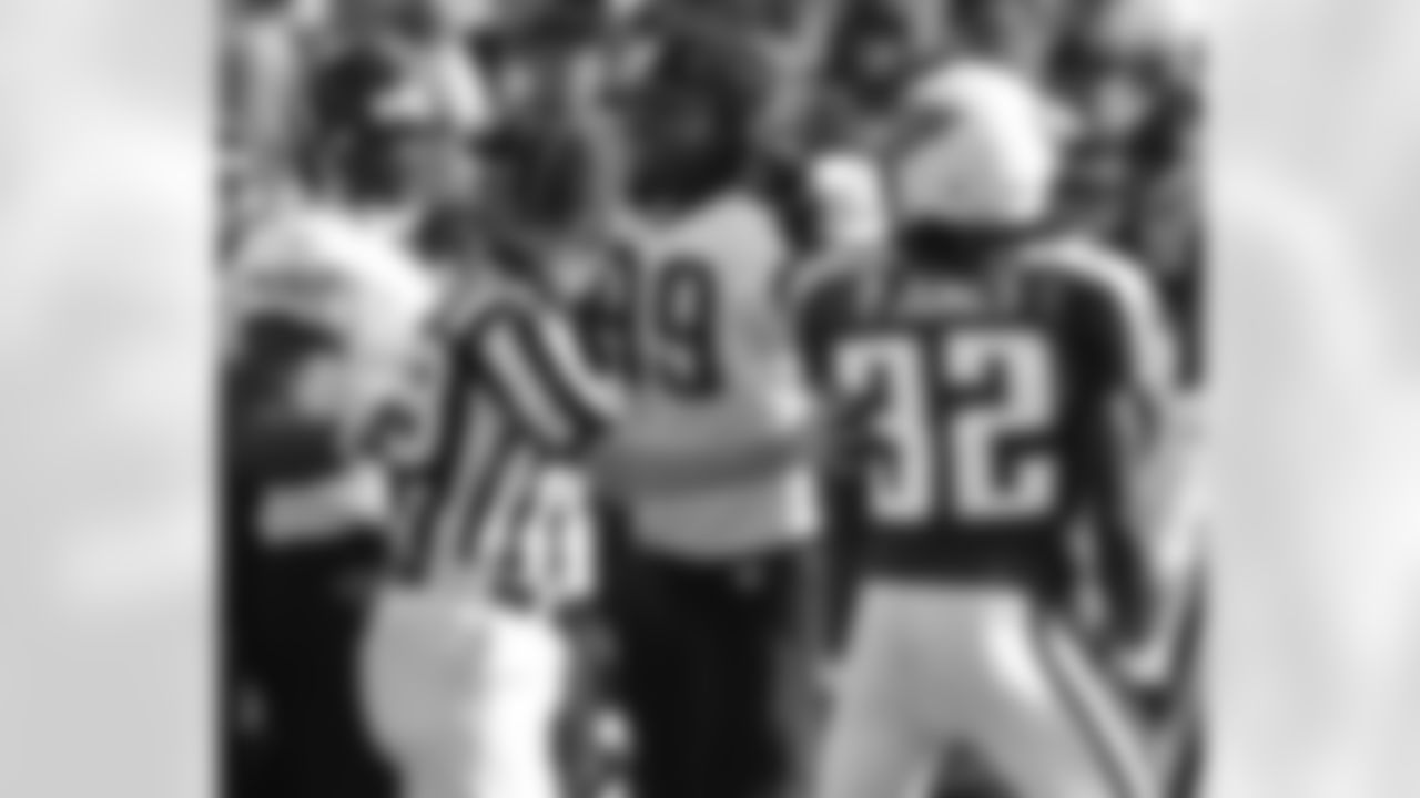 Tennessee Titans cornerback Packman Jones (32) is pushed away from Jacksonville Jaguars fullback Greg Jones, left, and defensive tackle Marcus Stroud (99) during the Jaguars' 31-28 win over the Titans on Sunday, Nov. 20, 2005, in Nashville, Tenn. Jones was called for unsporstmanlike conduct on the play. Penalties are a big part of why the Titans will be trying to snap a five-game losing streak when they play the San Francisco 49ers on Sunday, Nov. 27. (AP Photo/Mark Humphrey)