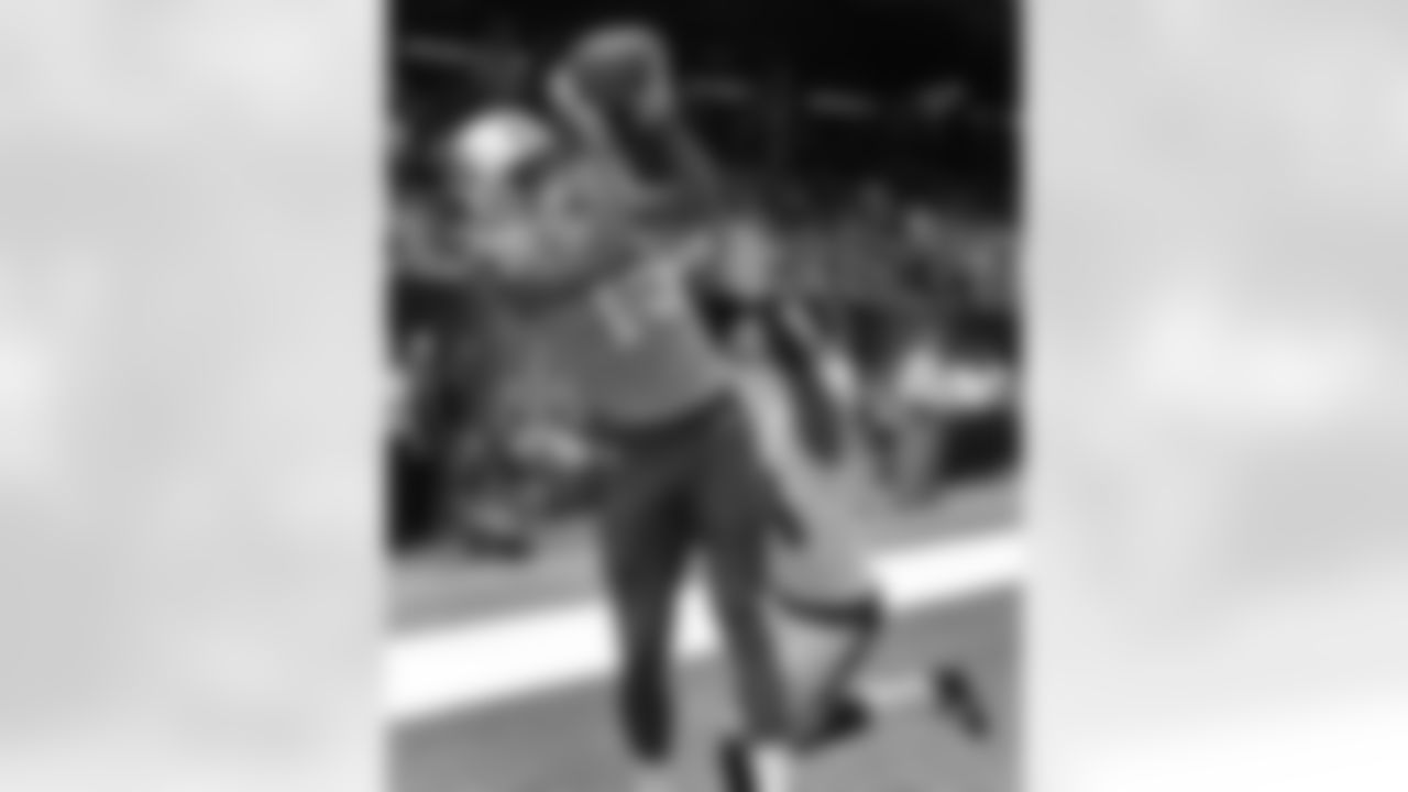 Tennessee Titans wide receiver Justin Hunter (15) pulls in a touchdown reception over New Orleans Saints cornerback Corey White (24) in the first half of a NFL preseason football game in New Orleans, Friday, Aug. 15, 2014. (AP Photo/Bill Haber)