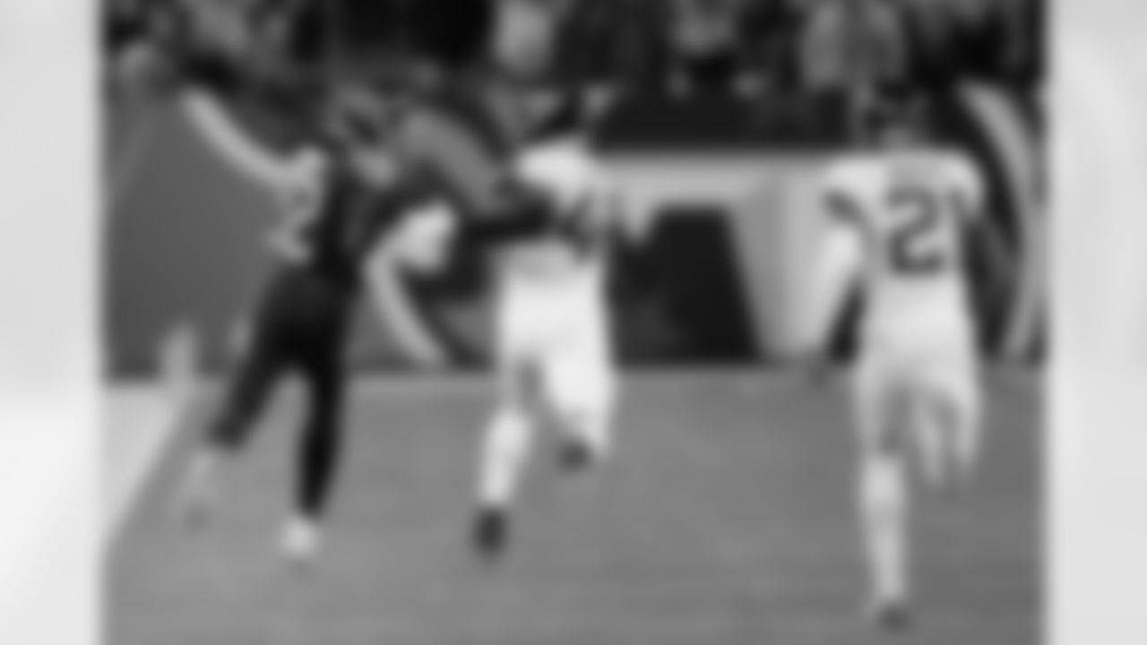 Tennessee Titans running back Derrick Henry (22) runs past Jacksonville Jaguars outside linebacker Leon Jacobs (48) for a touchdown during the first half of an NFL football game, Thursday, Dec. 6, 2018, in Nashville, Tenn. Henry scored a touchdown on the 99-yard run. (AP Photo/Mark Zaleski)