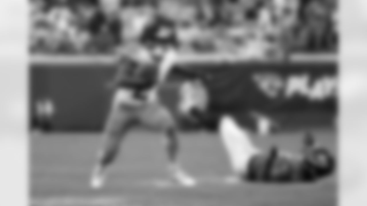 Tennessee Titans running back Tyjae Spears (2) runs past Jacksonville Jaguars defensive end Josh Hines-Allen, right, during the second half of an NFL football game, Sunday, Dec. 29, 2024, in Jacksonville, Fla. (AP Photo/Phelan M. Ebenhack)