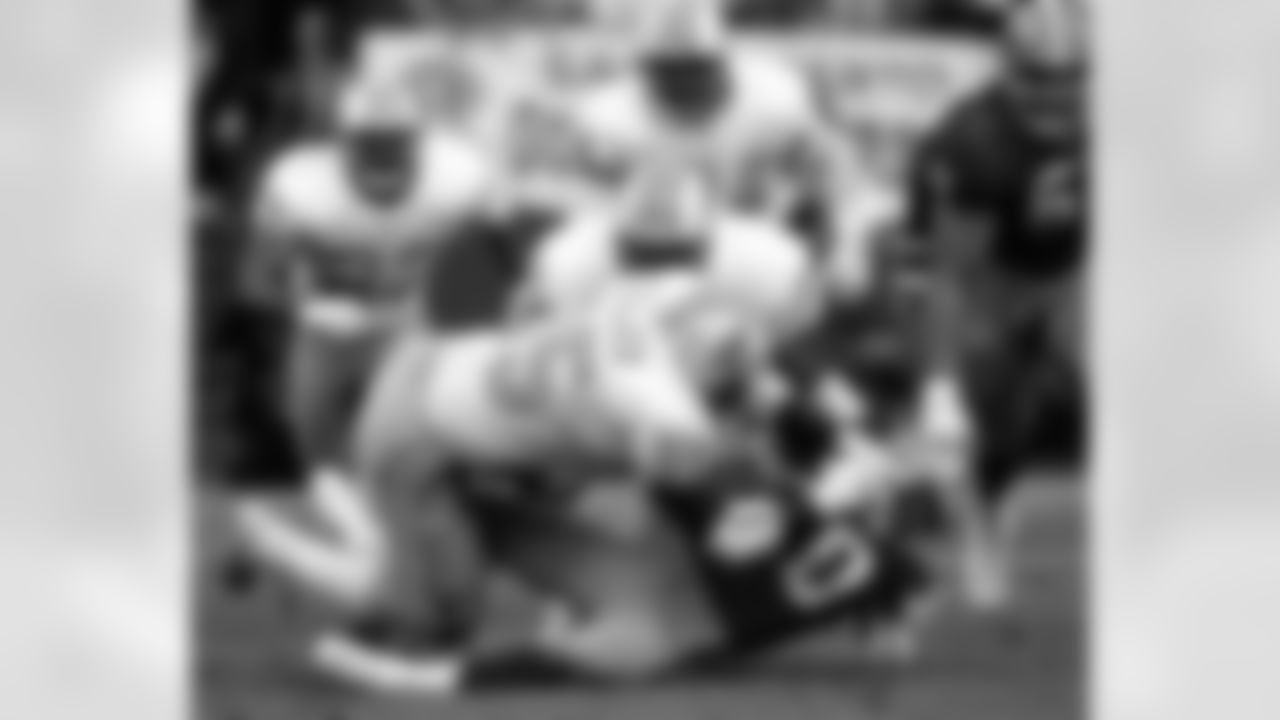 Houston Oilers defensive tackle William Fuller (95) and linebacker Lamar Lathon (57) stop San Francisco 49ers Hall of Fame wide receiver Jerry Rice (80) during an NFL game at San Francisco, Dec. 25, 1993. (AP Photo/Greg Trott)