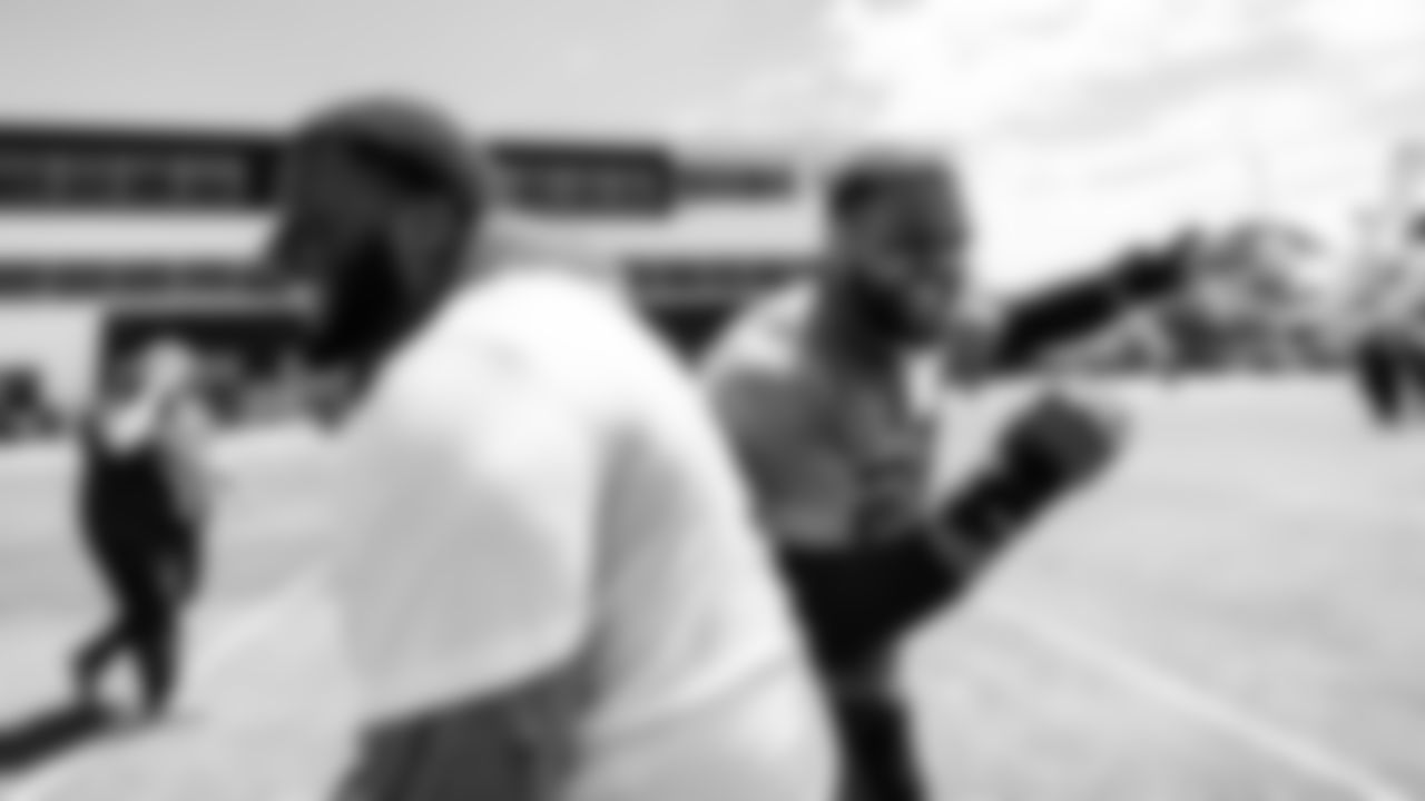 Defensive lineman Keondre Coburn #91 of the Tennessee Titans and Tackle Dan Moore Jr. #75 of the Tennessee Titans during phase 2 workouts at the Ascension Saint Thomas Sports Park on May 22, 2025 in Nashville, TN. Photo By Donald Page/Tennessee Titans