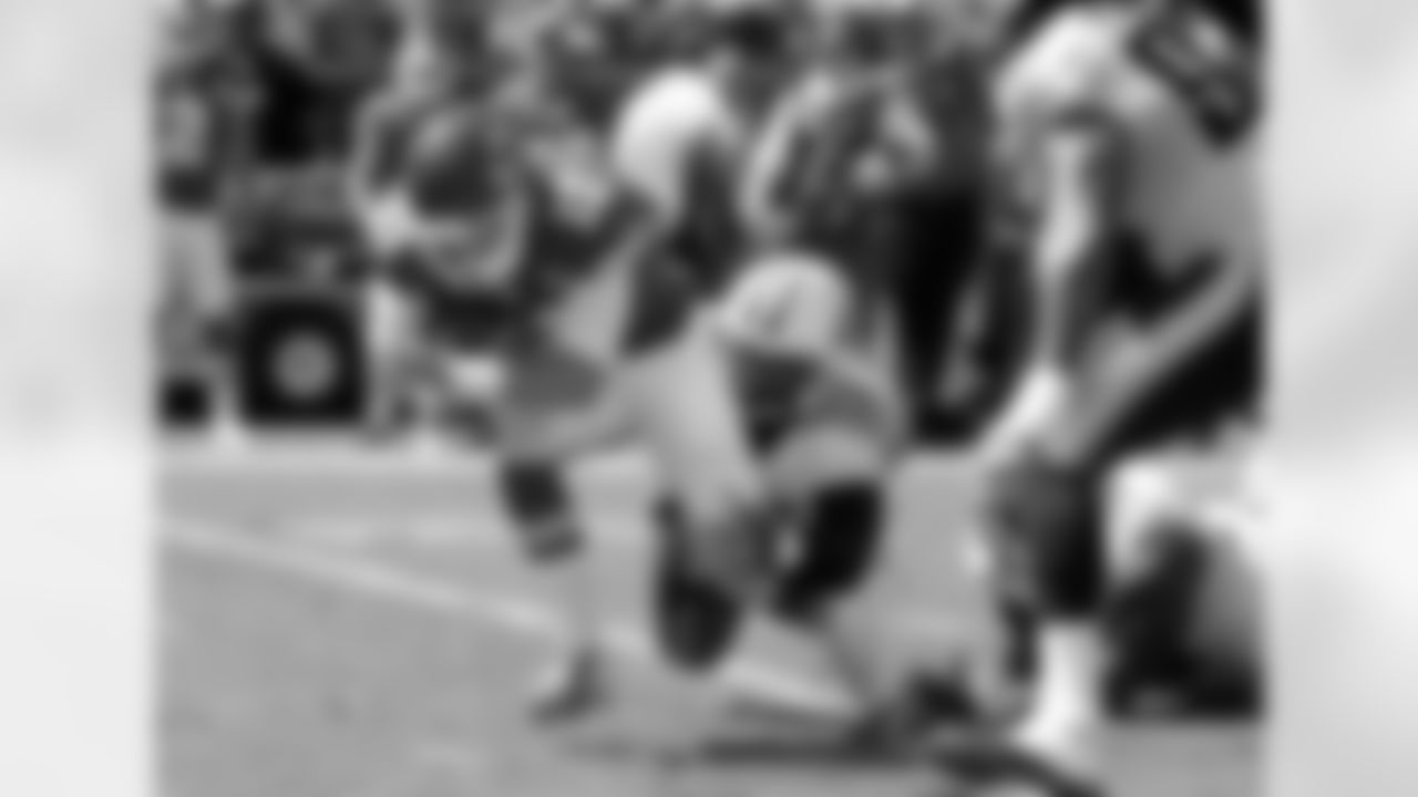 Tennessee Titans linebacker Shaun Phillips (58) tackles Kansas City Chiefs quarterback Alex Smith (11) in the first half of an NFL football game in Kansas City, Mo., Sunday, Sept. 7, 2014. (AP Photo/Charlie Riedel)