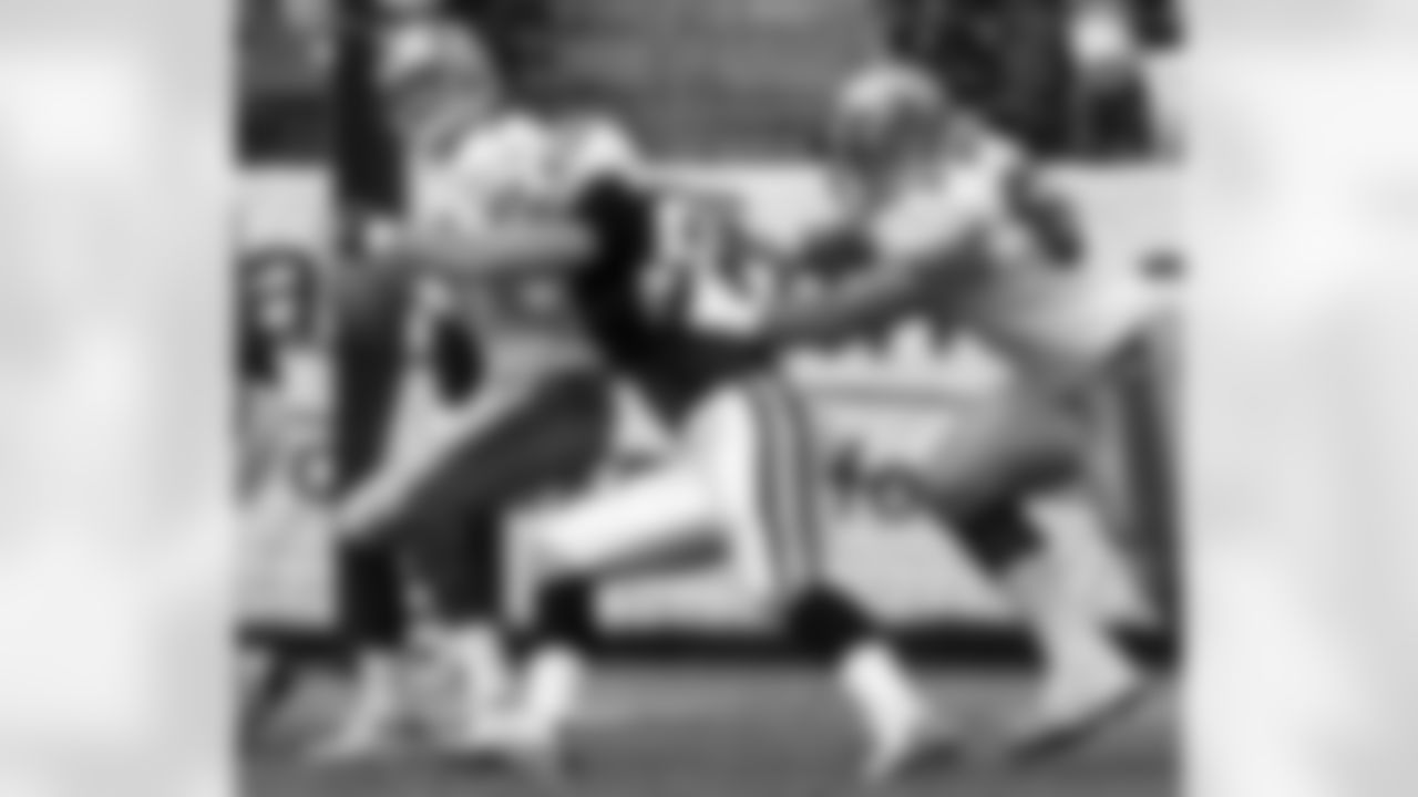 Tennessee Titans defensive end Kyle Vanden Bosch, center, sacks San Francisco 49ers quarterback Ken Dorsey as 49ers' guard Adam Snyder, right, defends against Vanden Bosch Nov. 27, 2005, in Nashville, Tenn. Vanden Bosch, a five-year veteran whose first four seasons were marred by ACL injuries to both knees, finds himself being pitched for a slot on the AFC Pro Bowl roster thanks to his career-high 10 1/2 sacks. (AP Photo/John Russell)