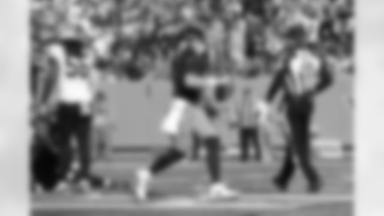 Tennessee Titans quarterback Ryan Tannehill, center, celebrates after scoring a touchdown against the New Orleans Saints in the first half of an NFL football game Sunday, Nov. 14, 2021, in Nashville, Tenn. (AP Photo/John Amis)