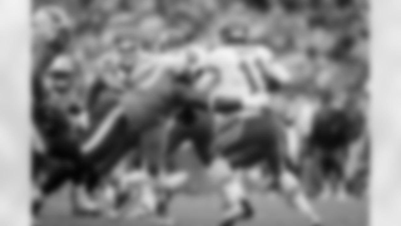 Tennessee Titans defensive tackle Antonio Johnson (90) sacks Kansas City Chiefs quarterback Alex Smith (11) during an NFL football game on Sunday, October 6, 2013. The Chiefs won 26-17. (AP Photo/Paul Abell)