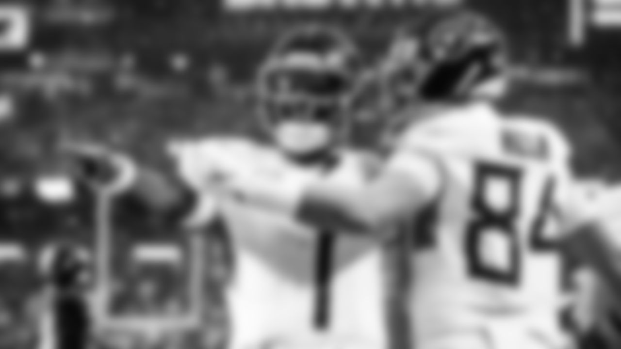 Quarterback Cam Ward #1 of the Tennessee Titans, Tight end Gunnar Helm #84 of the Tennessee Titans during the game between the Tennessee Titans and the Cleveland Browns at Huntington Bank Field on December 07, 2025 in Cleveland, OH. Photo By Donald Page/Tennessee Titans