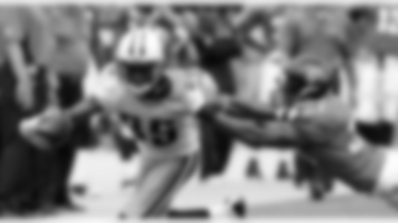 Tennessee Titans wide receiver Nate Washington tries to break free from Jacksonville Jaguars cornerback Derek Cox  during the second quarter of an NFL football game, Sunday, Oct. 4, 2009, in Jacksonville, Fla. (AP Photo/Phil Coale)