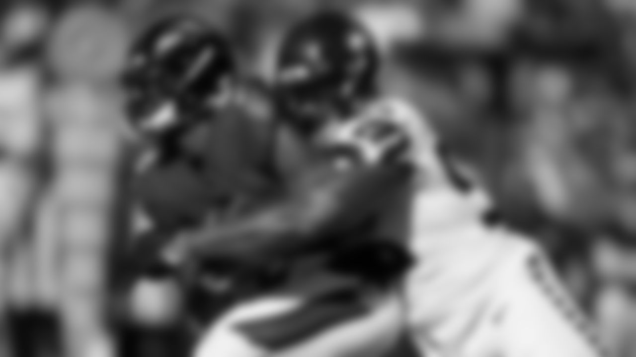 Baltimore Ravens quarterback Lamar Jackson is sacked by Seattle Seahawks defensive end Dre'Mont Jones, right, during the first half of an NFL football game, Sunday, Nov. 5, 2023, in Baltimore. (AP Photo/Nick Wass)