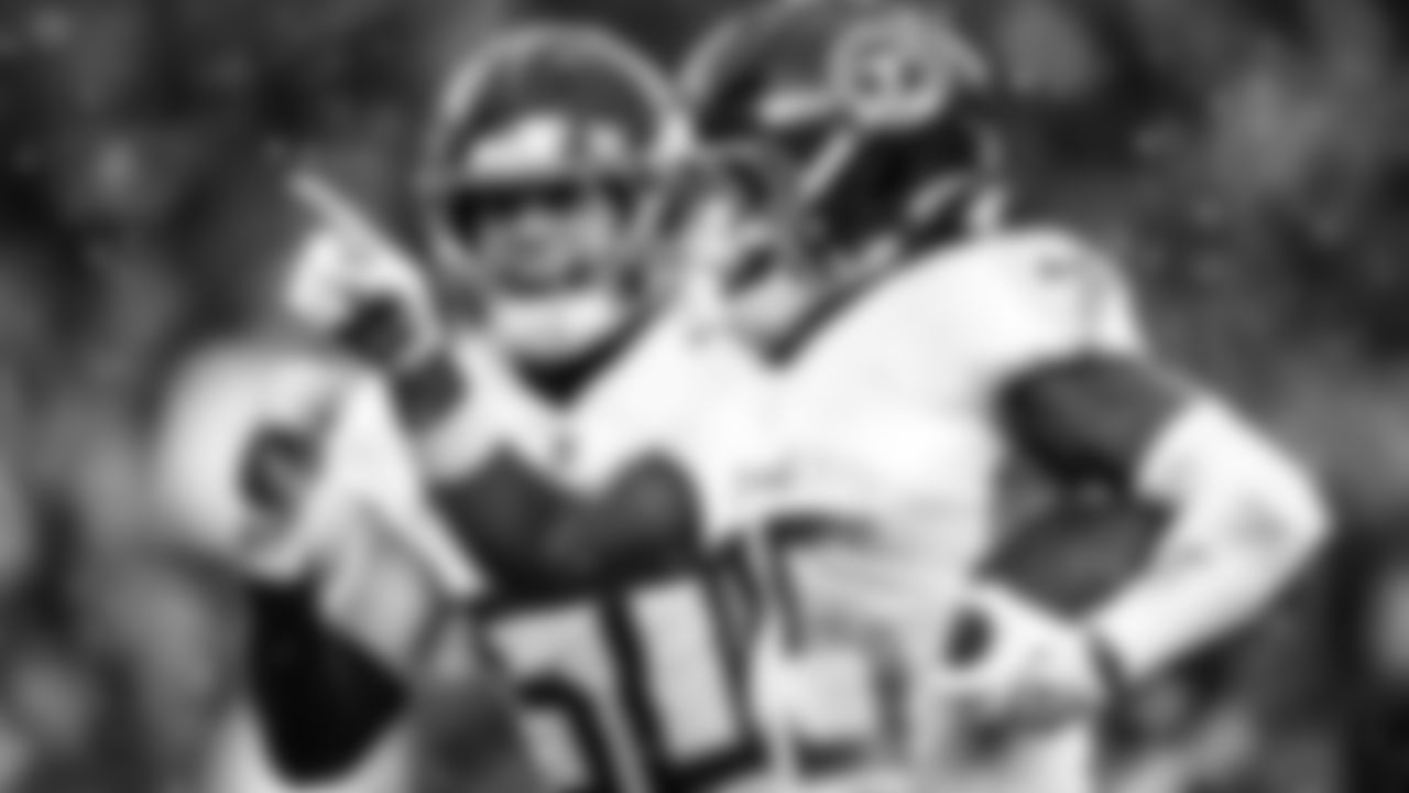 Linebacker Cody Barton #50 of the Tennessee Titans, Safety Xavier Woods #25 of the Tennessee Titans during the game between the Tennessee Titans and the Cleveland Browns at Huntington Bank Field on December 07, 2025 in Cleveland, OH. Photo By Jessie Rogers/Tennessee Titans