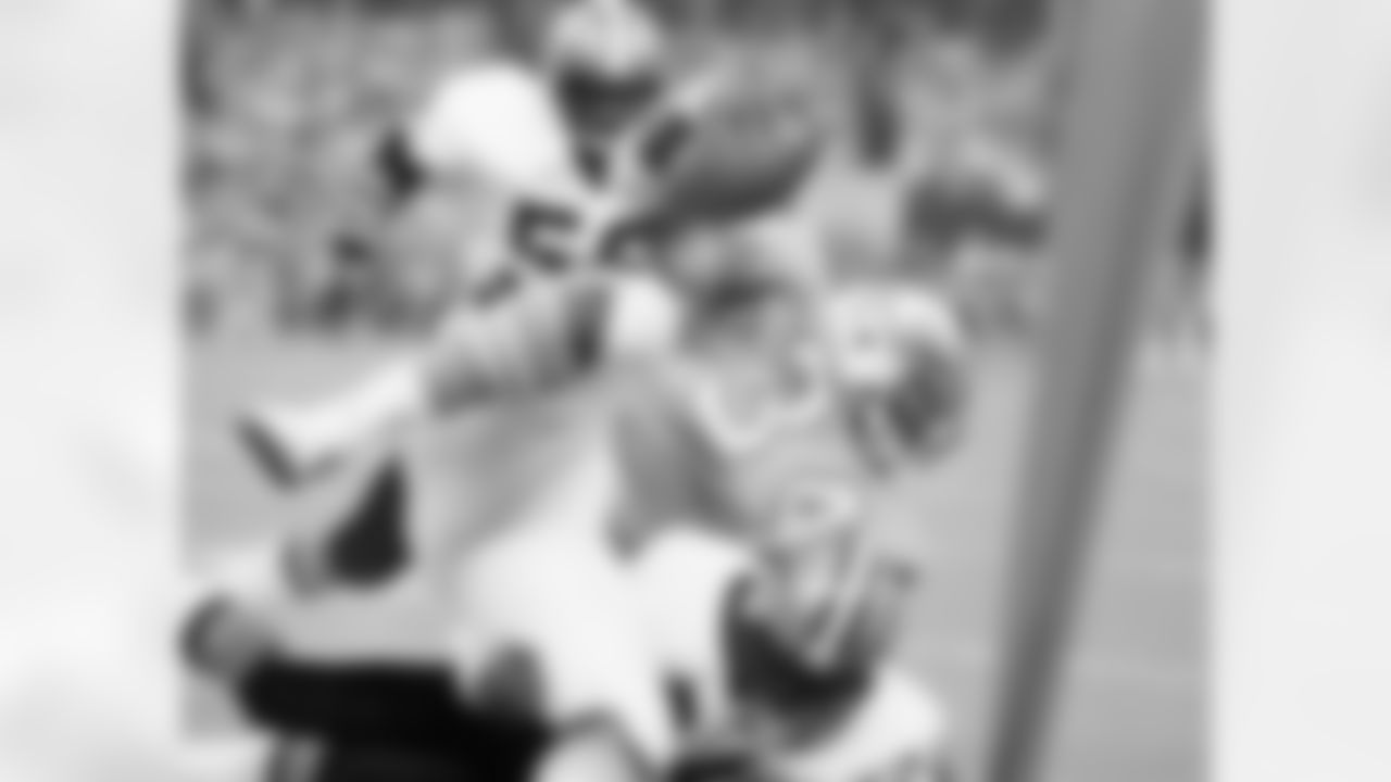 Houston Oilers' running back Earl Campbell (34) upended by New Orleans Saints' Clarence Chapman (24) in the first quarter of the NFL exhibition game at Houston, Texas, Sunday, Aug. 18, 1980. Campbell took a pass in the fifth flats from his quarterback Ken Stabler to pick up four yards on the play. (AP Photo/Ed Kolenovsky)