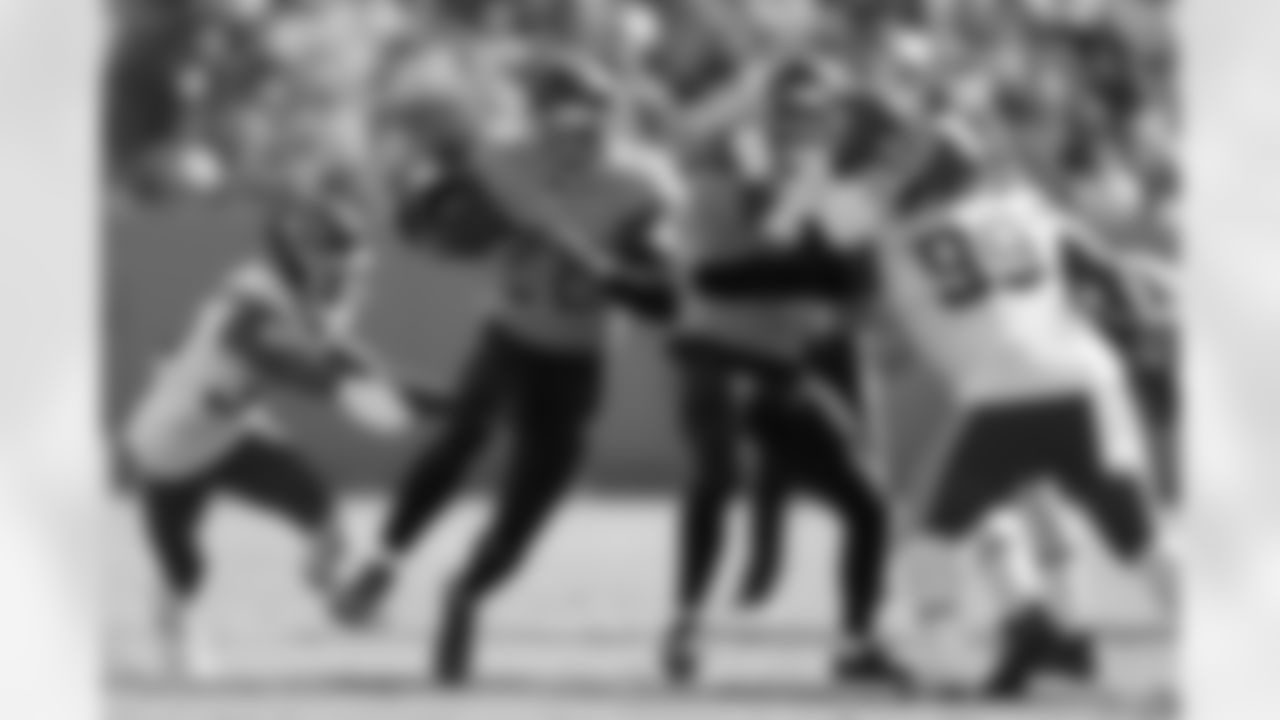 Tennessee Titans running back Derrick Henry (22) carries the ball past Kansas City Chiefs defensive tackle Khalen Saunders (99) in the first half of an NFL football game Sunday, Oct. 24, 2021, in Nashville, Tenn. (AP Photo/Wade Payne)