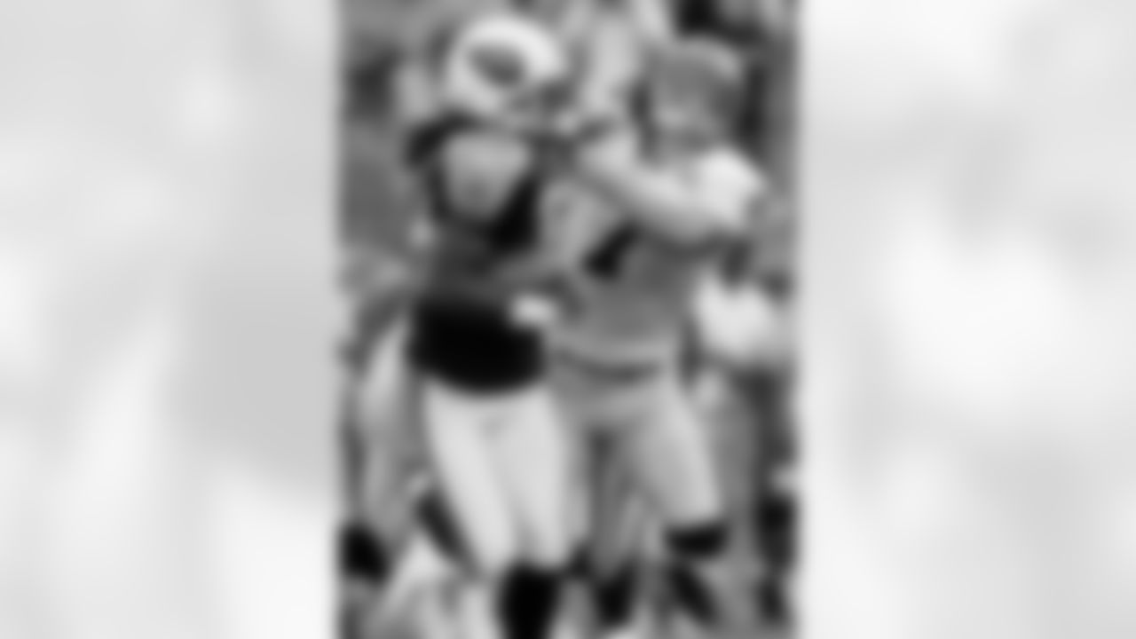 Tennessee Titans punt-returner Pacman Jones (32) straight-arms New Orleans Saints punter Steve Weatherford (7) as Jones returns a punt in the first quarter of their pre-season football game in Nashville, Tenn., on Saturday, Aug. 12, 2006. (AP Photo/John Russell)