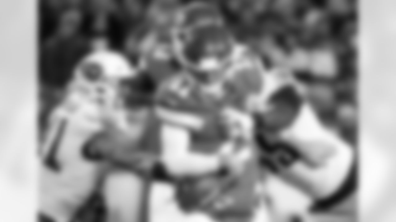 Tennessee Titans defensive end David King (95) and linebacker Derrick Morgan (91) sack Kansas City Chiefs quarterback Alex Smith (11) during the second half of an NFL wild-card playoff football game, in Kansas City, Mo., Saturday, Jan. 6, 2018. (AP Photo/Charlie Riedel)