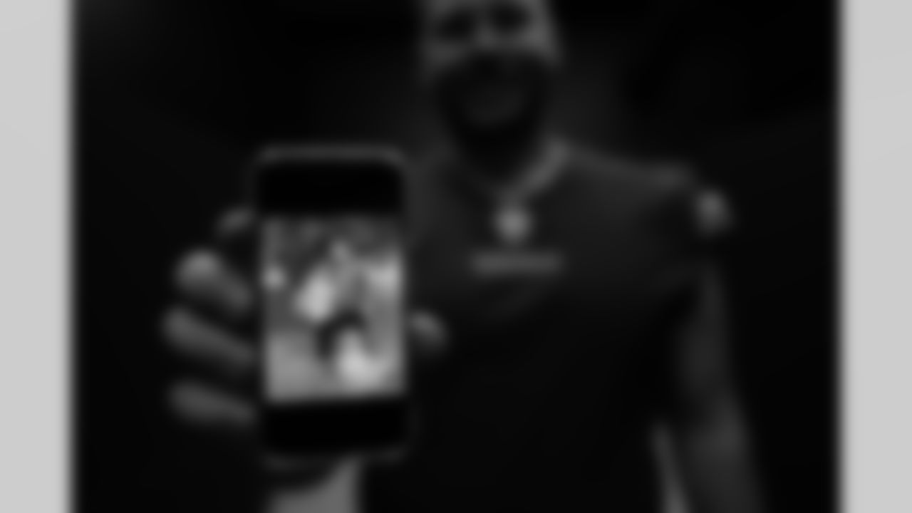 OL Michael Jurgens shows a picture of himself with his Mom and dog.