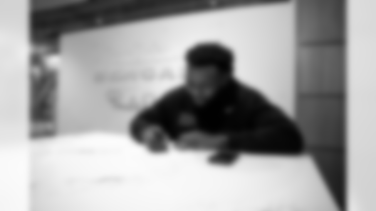 OT Jalen Rivers signs his rookie contract, Thursday, May 8, 2025.