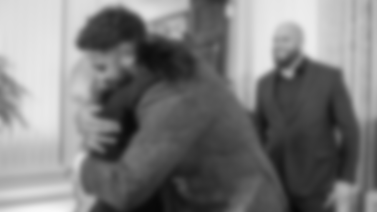 Jordan Mailata hugs First Lady Jill Biden.