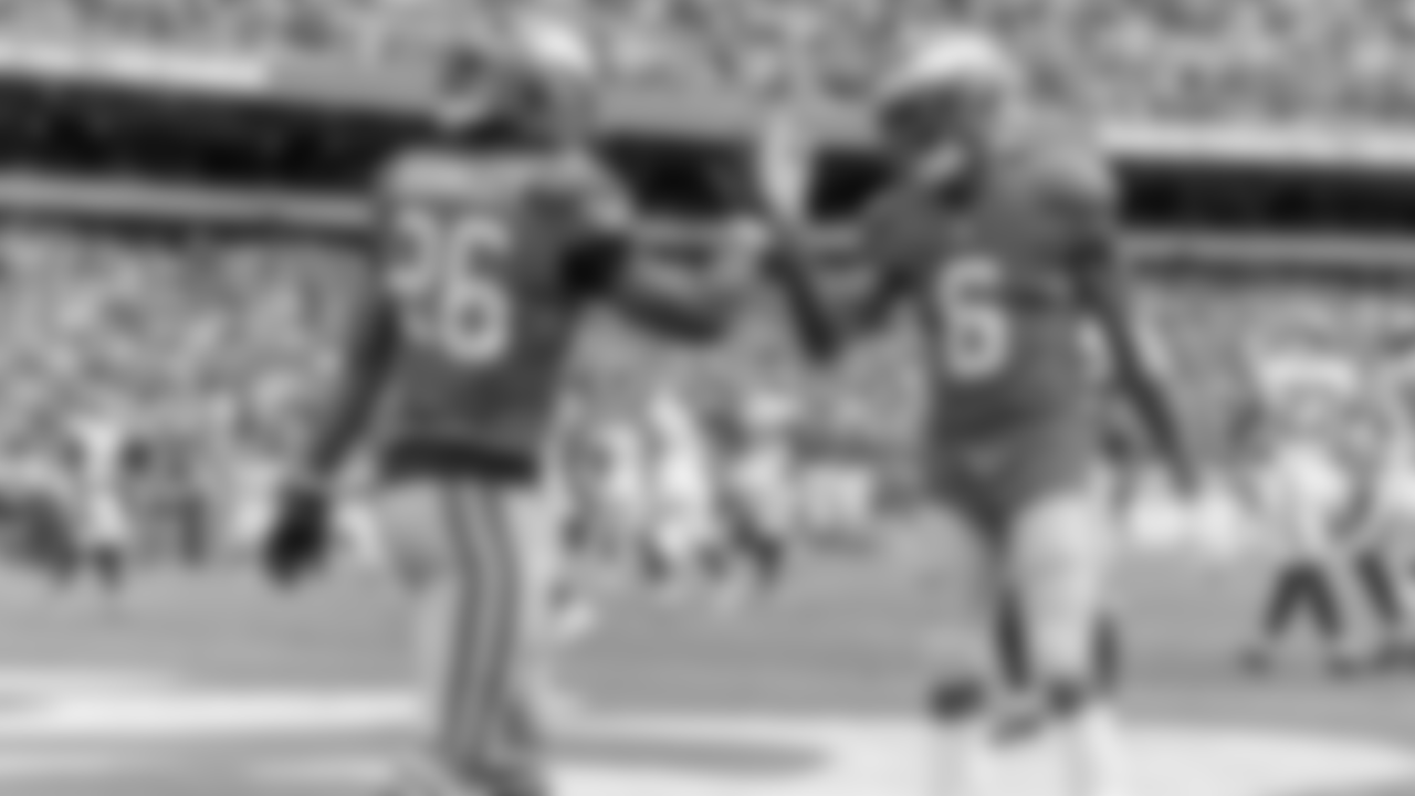 Saquon Barkley and DeVonta Smith celebrate.