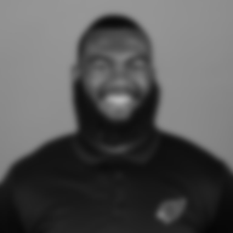 A headshot of Bill Bidwill coaching fellow Blaine Gautier of the Arizona Cardinals in May 2024.