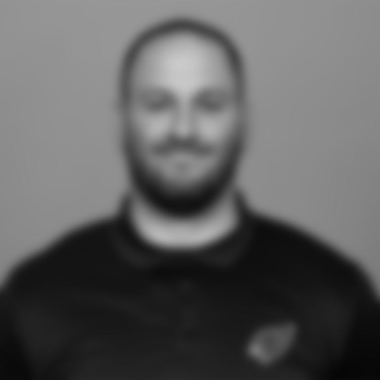 A headshot of Bill Bidwill coaching fellow Blaine Gautier of the Arizona Cardinals in May 2024.