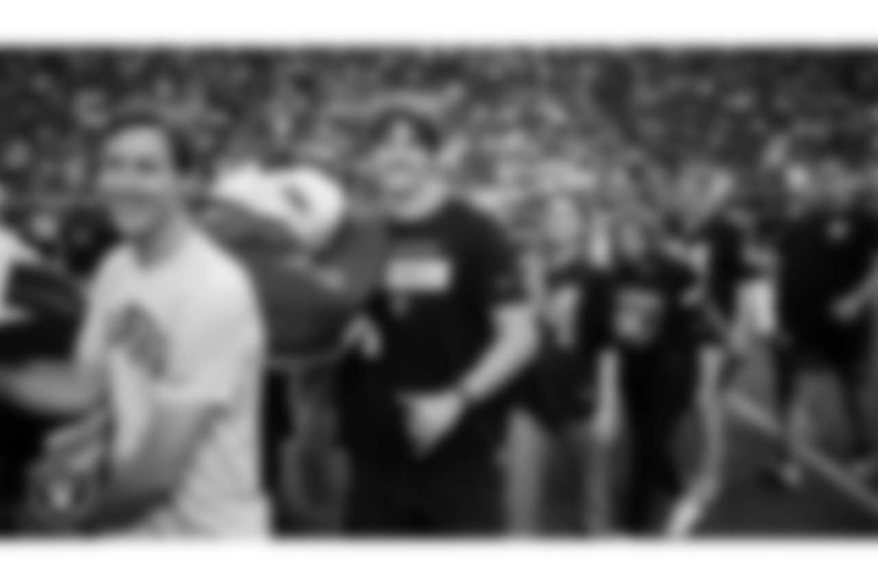 The American flag is displayed by Personal Seat License (PSL) holders on the field during the national anthem before the Las Vegas Raiders' regular season home game against the Jacksonville Jaguars at Allegiant Stadium.