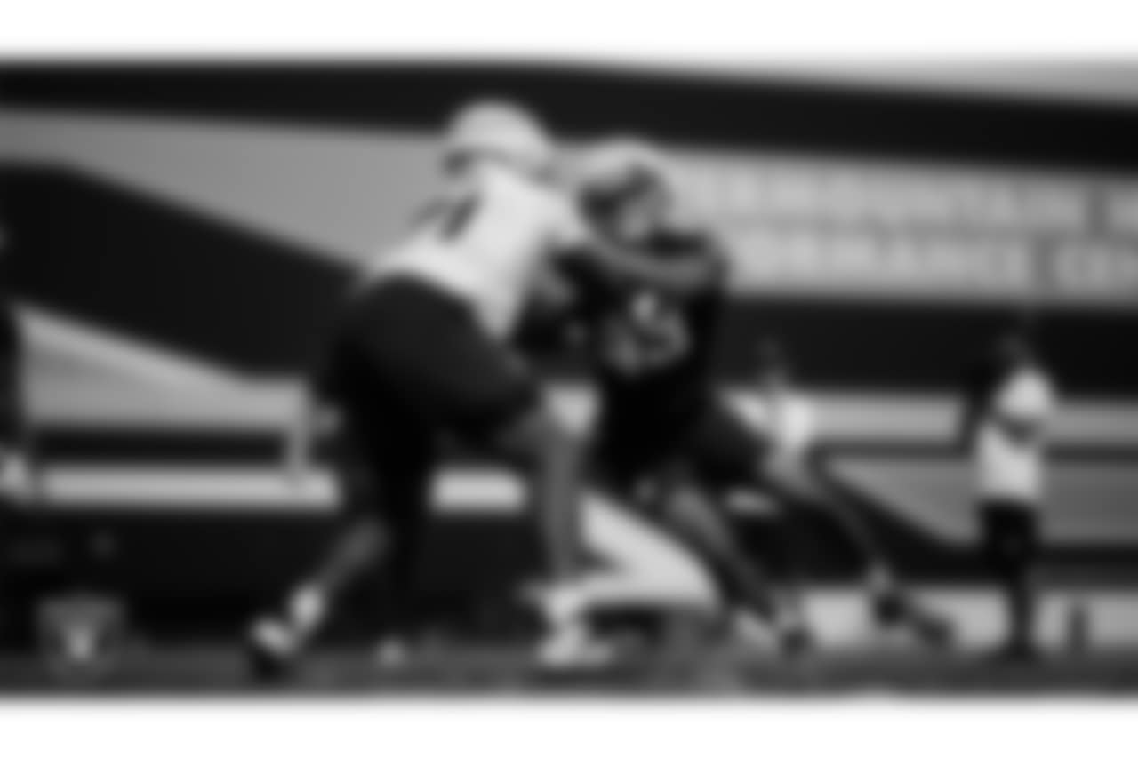 Las Vegas Raiders tackle DJ Glaze (71) and defensive end Charles Snowden (49) during practice at Intermountain Health Performance Center.