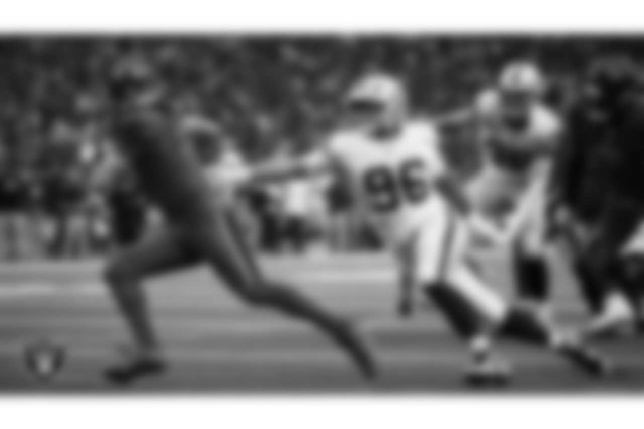 Las Vegas Raiders defensive tackle Jonah Laulu (96) pressures the quarterback during the regular season away game against the Houston Texans at NRG Stadium.