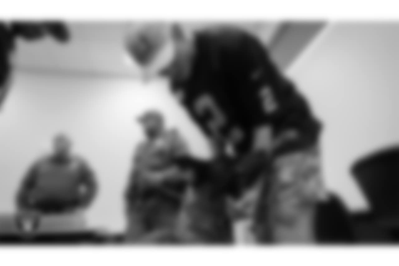 Las Vegas Raiders kicker Daniel Carlson (2) meets K-9 Raider during a visit to William Fortye K-9 Operations Center.