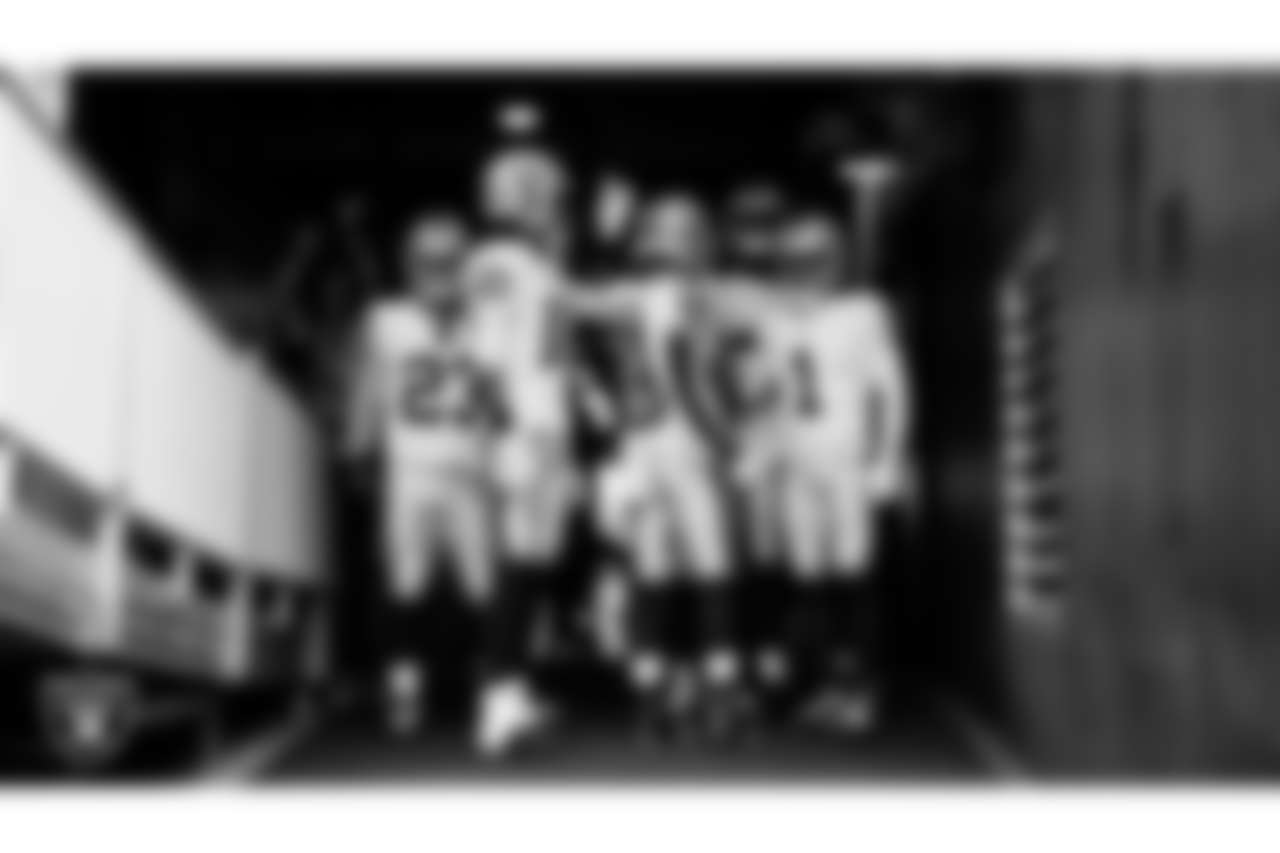 The Las Vegas Raiders returners huddle in the tunnel before the regular season away game against the Washington Commanders at Northwest Stadium.