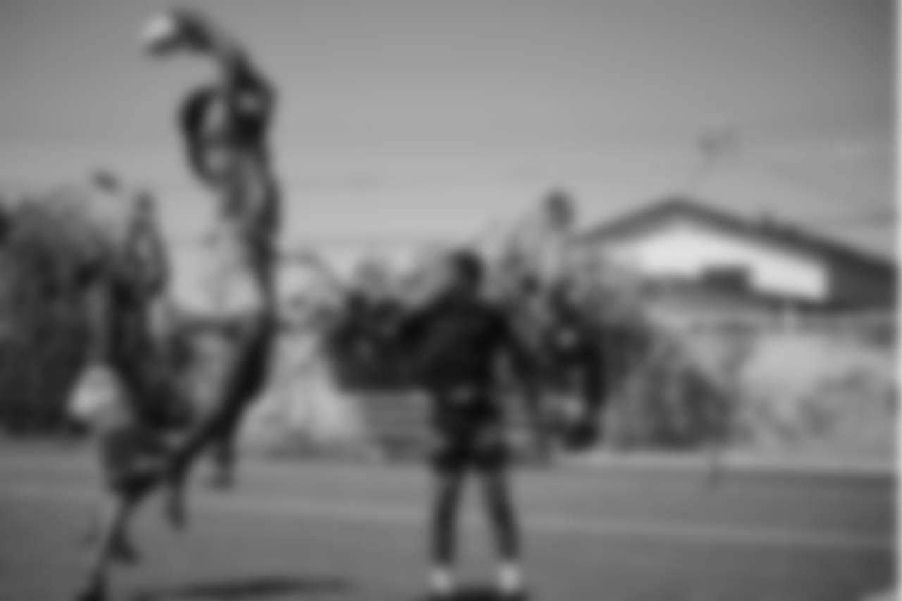 Athletes take part in a flag football game during a Las Vegas Raiders Silver and Black Saturday at the Bill and Lillie Heinrich YMCA.