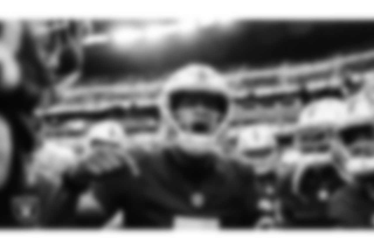 Las Vegas Raiders quarterback Geno Smith (7) leads a huddle during warm ups before the preseason home game against the San Francisco 49ers at Allegiant Stadium.