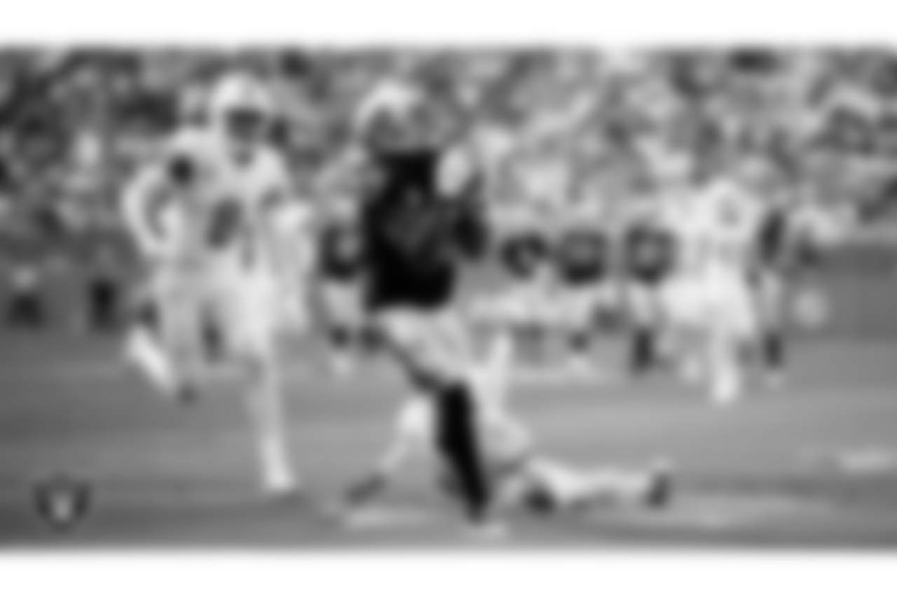 Las Vegas Raiders wide receiver Davante Adams (17) makes a 46-yard touchdown catch during the regular season game against the Miami Dolphins at Hard Rock Stadium.