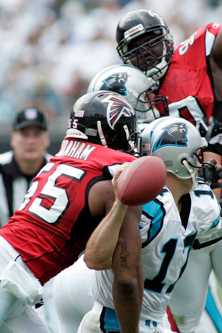Atlanta Falcons' John Abraham (55) hits Carolina Panthers quarterback Jake Delhomme (17) as Atlanta Falcons' Grady Jackson (90) leaps during the third quarter of the Falcons' 20-6 win in an NFL football game in Charlotte, N.C., Sunday, Sept. 10, 2006. Abraham had two sacks and forced two fumbles in his first game with the Falcons.