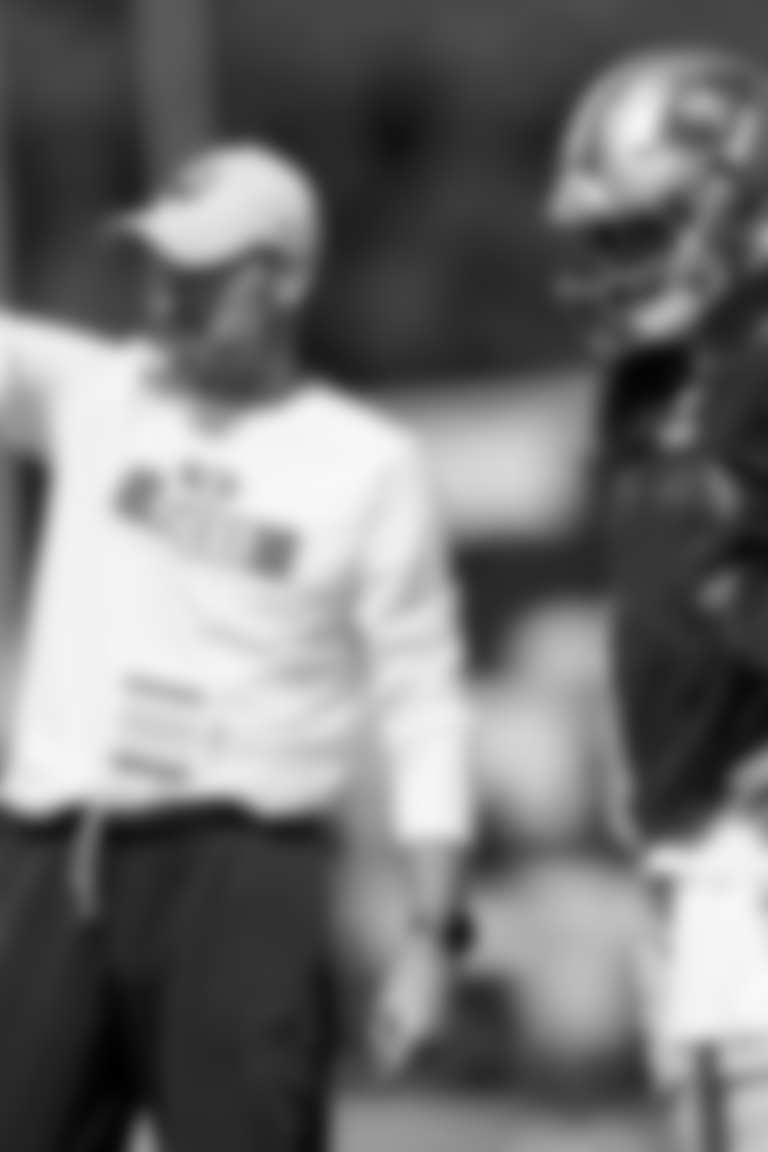 San Francisco 49ers offensive passing game specialist Klay Kubiak, left, talks with quarterback Brock Purdy (13) during NFL football training camp in Santa Clara, Calif., Wednesday, July 31, 2024. (AP Photo/Jeff Chiu)