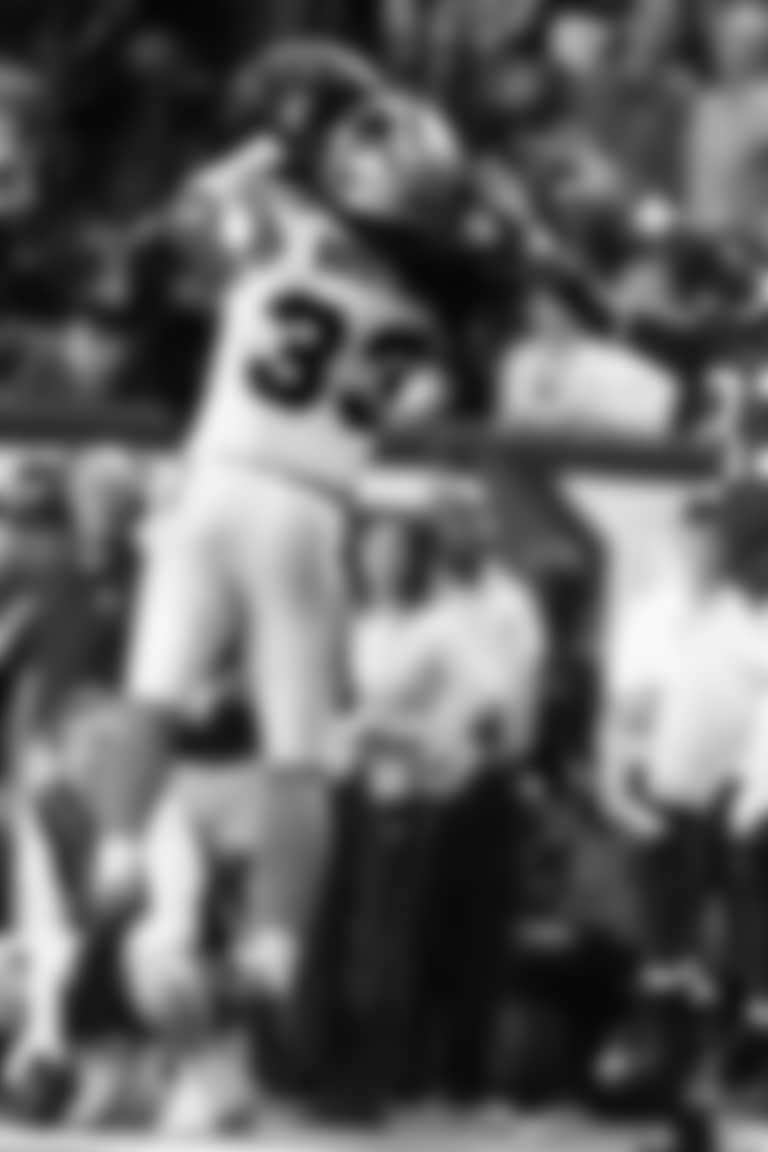 Carolina Panthers free safety Tre Boston (33) picks off a thrown ball intended for Atlanta Falcons wide receiver Harry Douglas (83) during the second half of an NFL football game, Sunday, Dec. 28, 2014, in Atlanta. Boston ran the ball back for a touchdown. (AP Photo/Brynn Anderson)