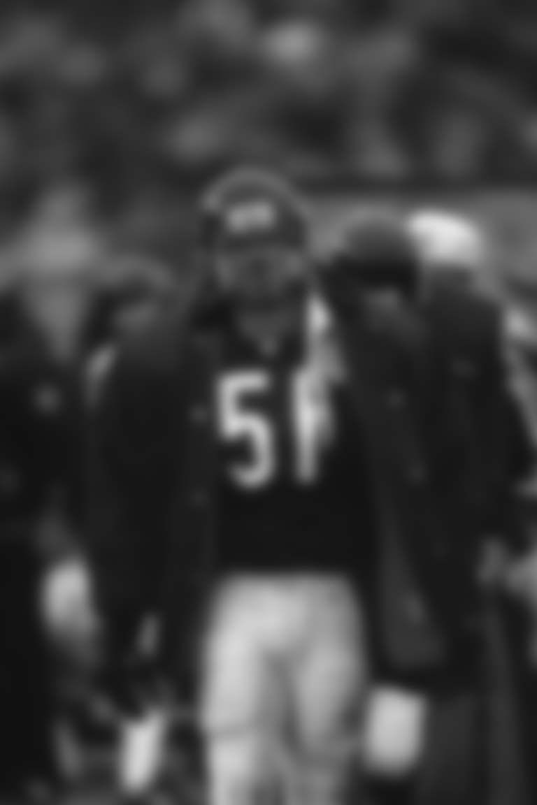 Chicago Bears linebacker Jim Morrissey (51) keeps warm on the sidelines between plays against the Pittsburgh Steelers in Chicago, IL, Dec. 13, 1992. The Bears defeated the Steelers 30-6. (Paul Spinelli via AP)