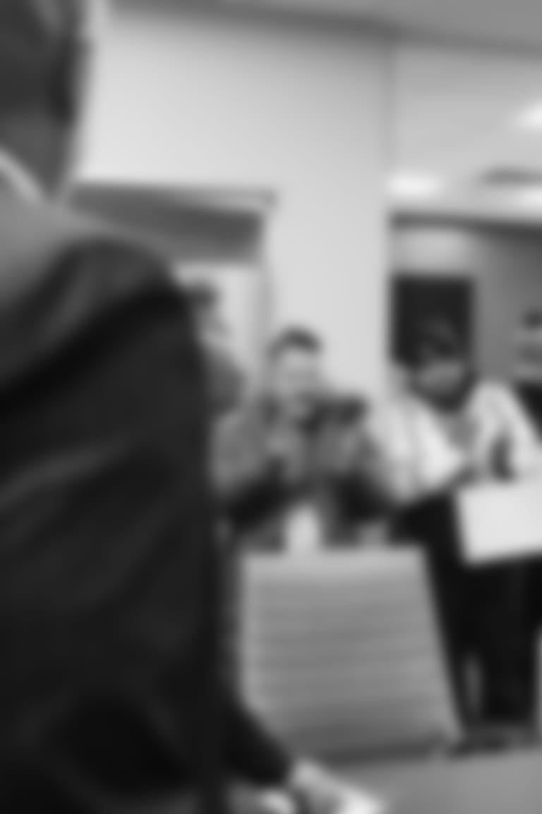 Kevin Warren and George H. McCaskey congratulate the winners of the Bears' Gameday Hero of the Year award.