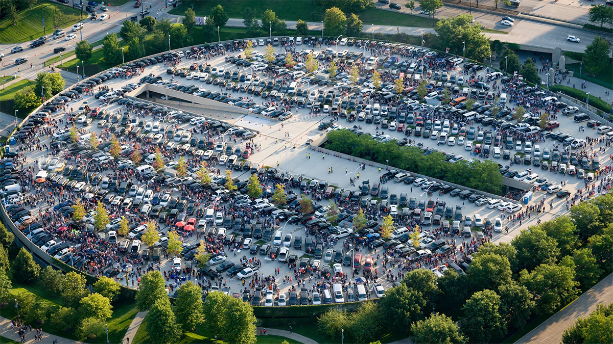 aerial photo of a parking lot with parked cars