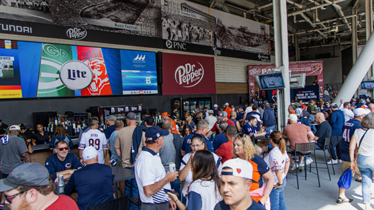 image of fans congregating in the dr. pepper patio at soldier field