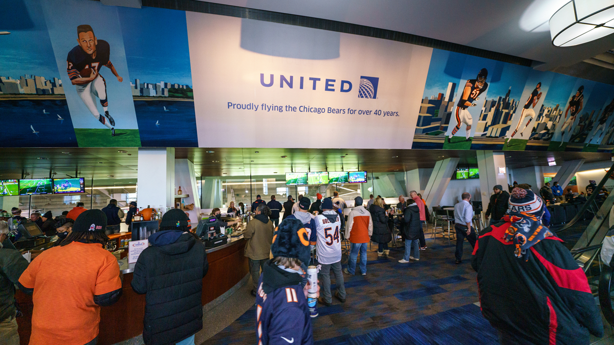 image of fans congregating in the united club at soldier field