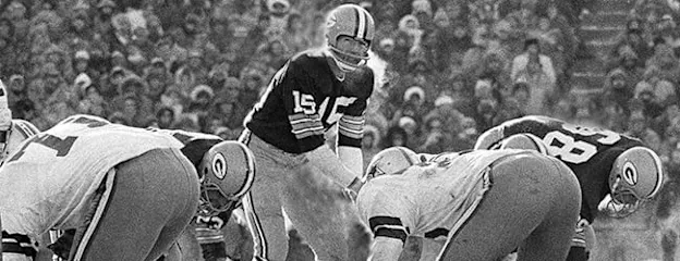 image: Football History Page The Ice BowlBart Starr of the Green Bay Packers taking a snap against the Dallas Cowboys during the ice bowl