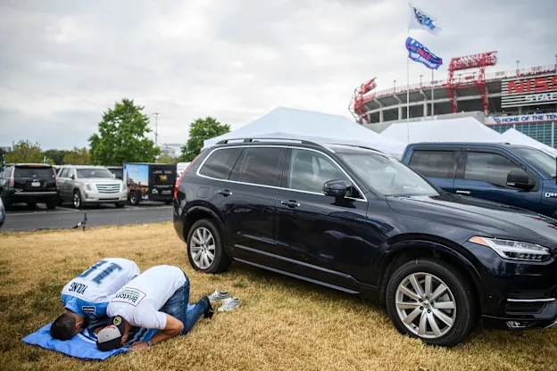 image: News Huddle Up America: At Tennessee Titans Games, the Fiercest Tailgaters Are KurdsWebKurdishPraying
