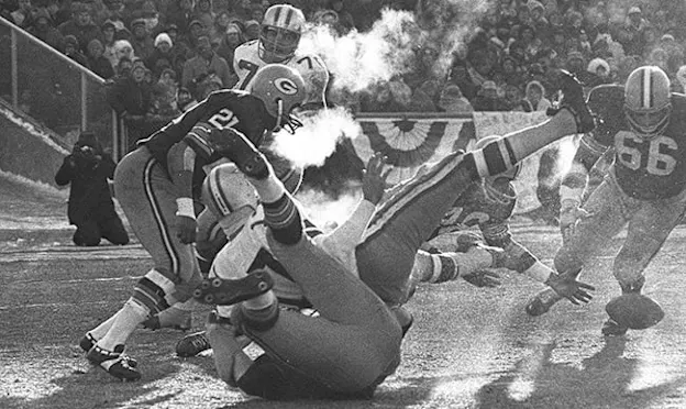 image: Football History Page The Ice BowlPackers and Cowboys players trying to recover a fumble during the ice bowl