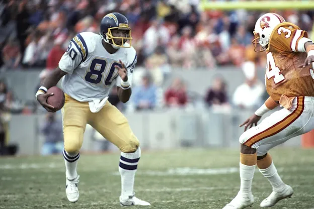 image: News The Tight End TrendHall of Fame tight end Kellen Winslow carries the football.