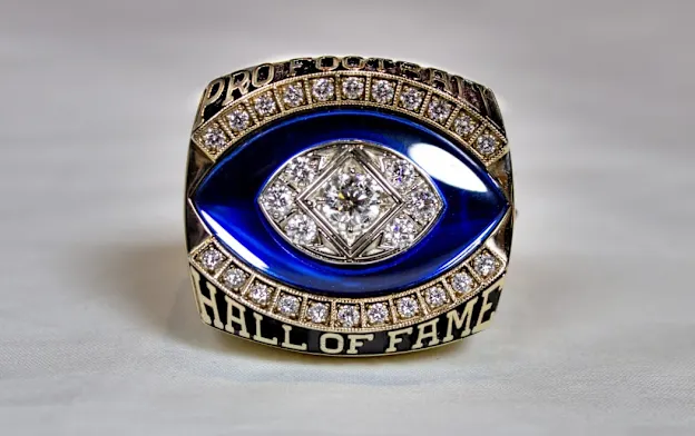image: News Centennial Class of 2020 & Class of 2021 Enshrinees to Receive HOF Ring of ExcellenceHOFRingExc1050Web